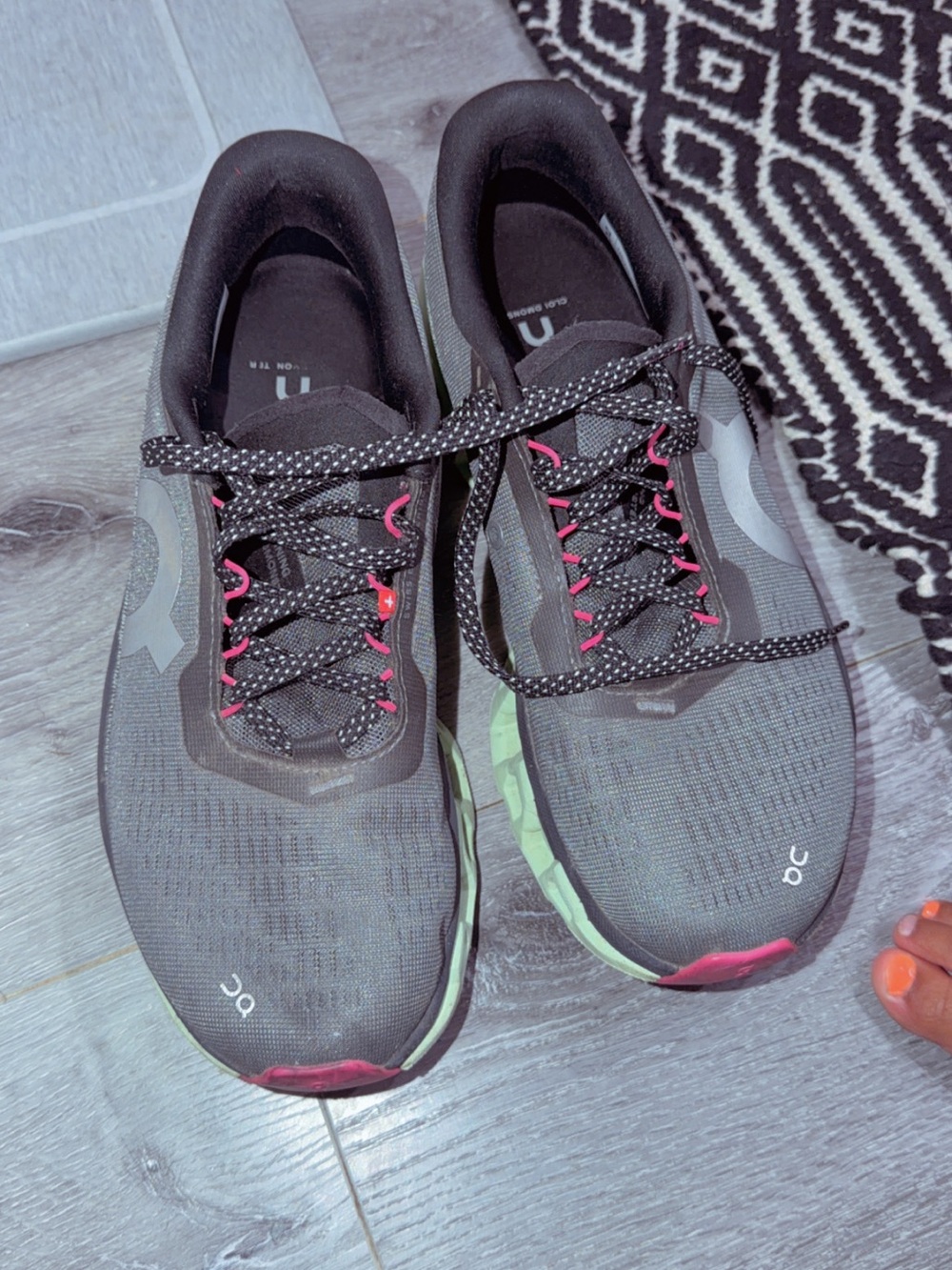 On Running Women's Black Running Shoes with Green Midsole and Pink